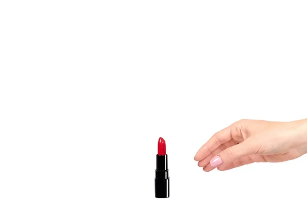 Hand with red lipstick in black tube, beauty and care. — Stock Photo, Image