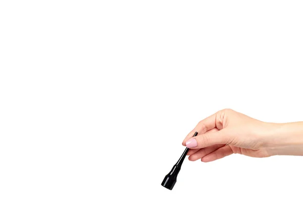 Hand with black liquid pencil, eye makeup brush. — Stock Photo, Image