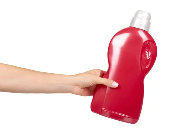 Hand mit roter Waschmittelflasche, Flüssigwaschseife für Textilien. — Stockfoto