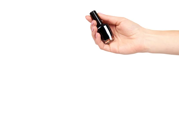 Hand with black nail polish bottle, beauty and care. — Stock Photo, Image