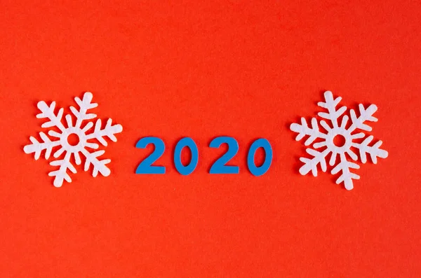 Number 2020 and white snowflakes composition on red background, New Year and Christmas holiday. — Stock Photo, Image