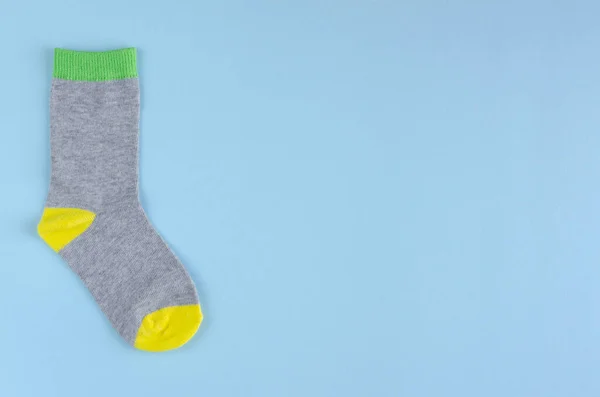 Kids socks composition on blue background. Flat lay. — Stock Photo, Image