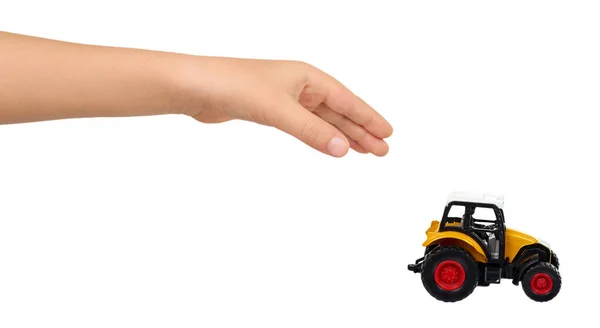 Yellow plastic traktor toy. Farming vehicle, harvest equipment. — Stock Photo, Image