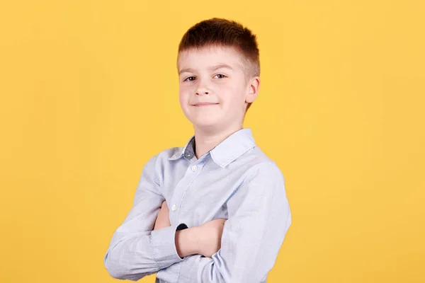 Portrait Confident Brunette Boy Looking Camera Crossed Hands Isolated Yellow — Stock Photo, Image