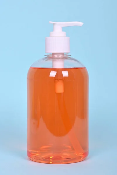 Bottle Orange Liquid Soap Blue Background High Quality Photo — Stock Photo, Image