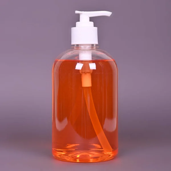Bottle Orange Liquid Soap Grey Background High Quality Photo — Stock Photo, Image
