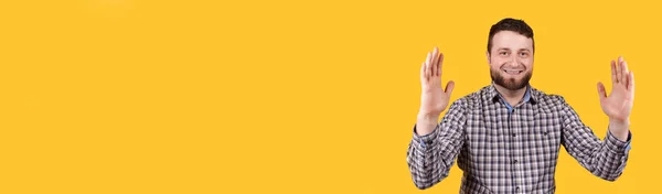 Man Smiling Shoving Size Hands Isolated Yellow Background — Stock Photo, Image