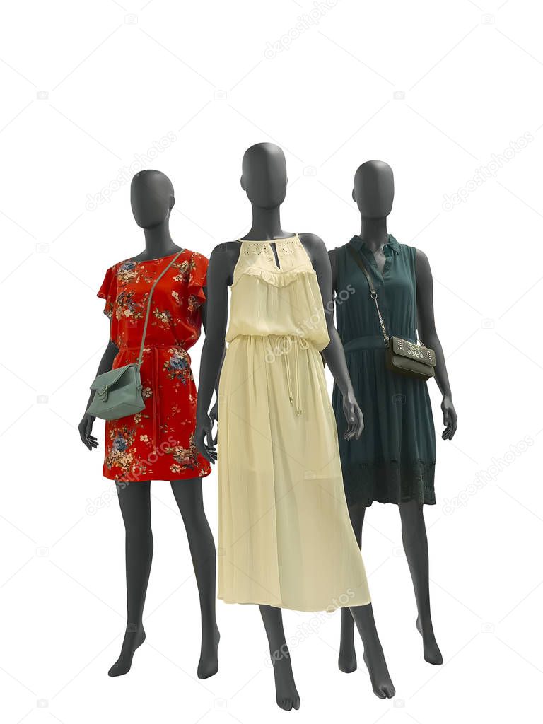 Three female mannequins dressed in fashionable clothes over white background. No brand names or copyright objects