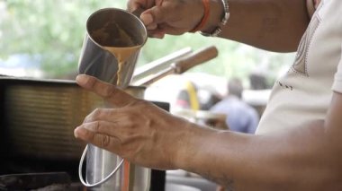 Masterful Hands Crafting Indian Style Coffee or Tea