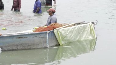 Early Morning Fishing - Treading Water in the Search for Bounty