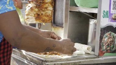 Hand at Work Rolling Up Street Food in India