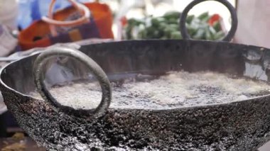 Masterful Hand Stirring Indian Street Food