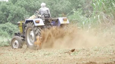 Farm Tractor in Action - Digging Deep into the Earth