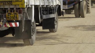 Truck Treads on Dusty Path - An Unexpected Journey Ahead