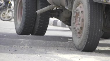 Tire Tread on Road - A Close-up Look at Wear and Tear