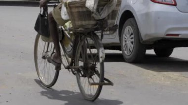Vibrant Street Life - Bicyclist Navigates Indian Roads