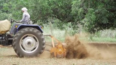 Agricultural Tractor in Action - A Moment in the Life of a Farming Hero