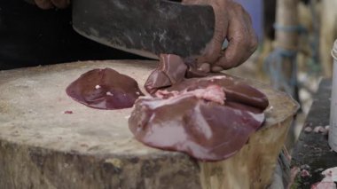 Efficient Meat Cutting Technique with Sharp Blade