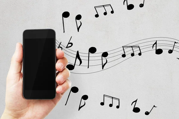 Männliche Hand Hält Leeres Smartphone Auf Betongrund Mit Notizen Musik — Stockfoto