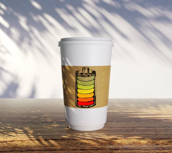 need coffee concept coffee paper mug displayed as low battery icon on wooden table at sunny outdoors background. 3D rendering