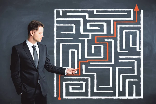 Problem and freedom concept. Businessman with creative maze labyrinth sketch