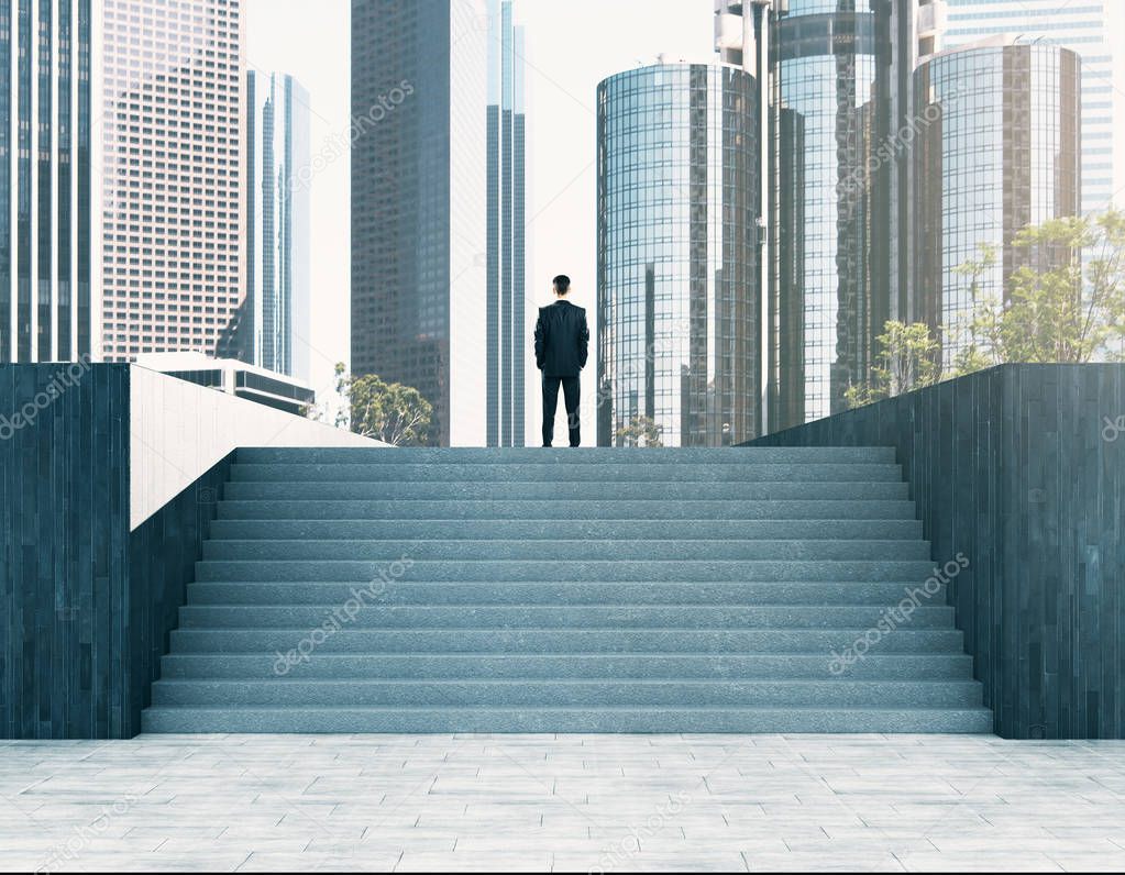 Businessman looking into the distance on abstract stairs. City background. Research and success concept 