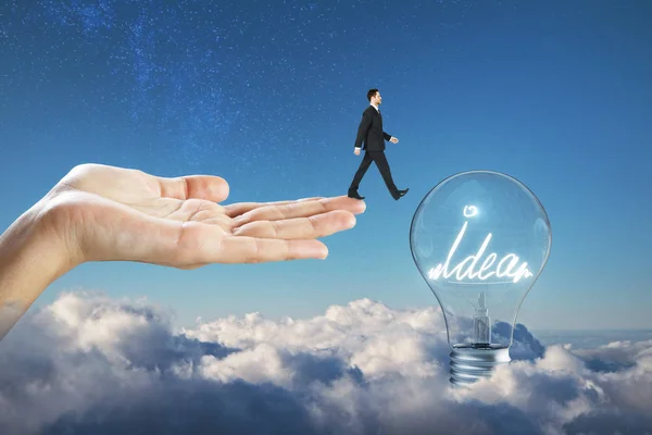 Hand Holding Businessman Walking Idea Lamp Blue Sky Clouds Background — Stock Photo, Image