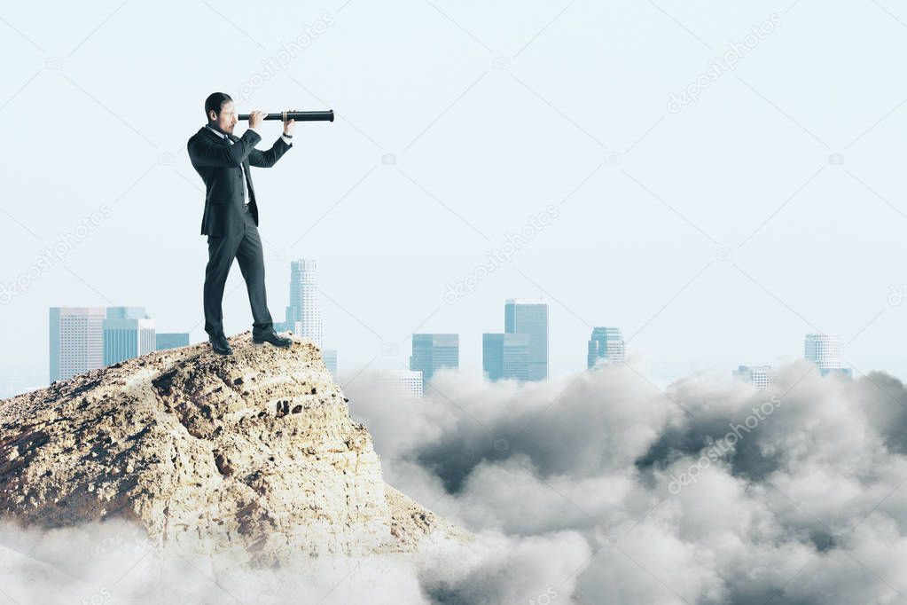 Side view of young businessman using telescope on cliff. Research and challenge concept 