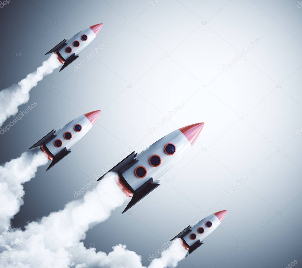 Launching rockets on gray background. Startup and project concept. 3D Rendering 