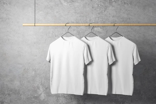 Empty Three White Tshirts Hanger Concrete Wall Background Design Store — Stock Photo, Image