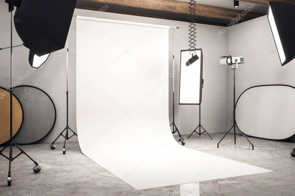 Side view of modern photo studio interior with white background, professional equipment and concrete floor. Mock up, 3D Rendering 