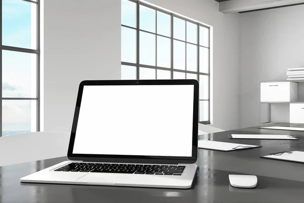 Designer desktop with empty white laptop computer screen in modern office interior. Design and ad concept. Mock up, 3D Rendering
