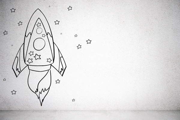 Creative rocket sketch on concrete wall background. Startup and project concept