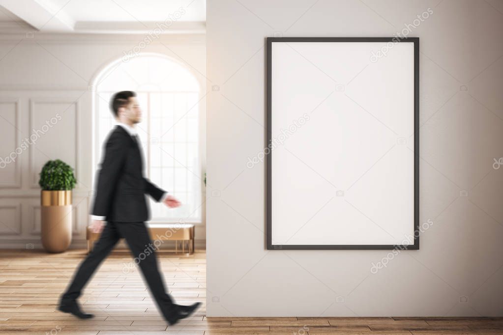 Blurry businessman walking in interior