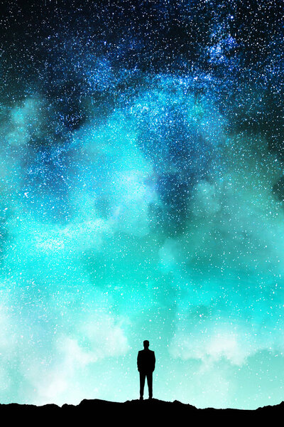 Tiny man silhouette on beautiful starry sky background. Purpose and freedom concept