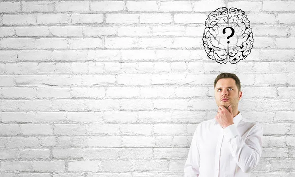 Thoughtful businessman with brain question — Stock Photo, Image