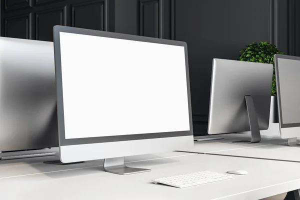 Designer desktop with empty white computer