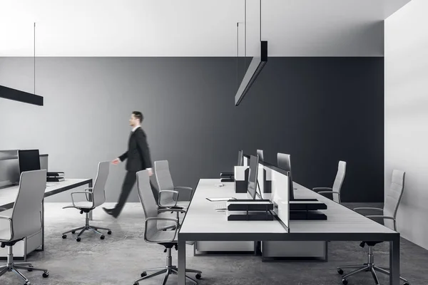 Businessman in gray office — Stock Photo, Image