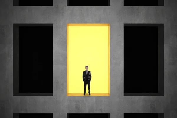 Businessman in concrete building — Stock Photo, Image