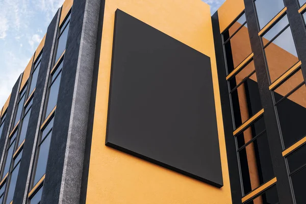 Empty black banner on orange building — Stock Photo, Image