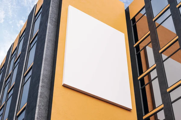 Empty white billbaord on orange building — Stock Photo, Image