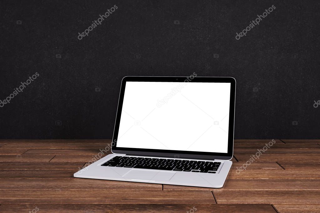 Empty white laptop on black background 