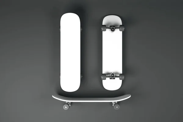 Three blank white skateboards at dark grey background, mock up.