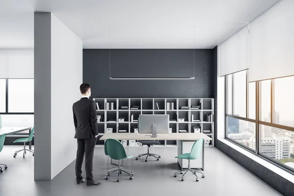 Businessman Standing Coworking Office Hall Computers Shelf Books City View — Stock Photo, Image