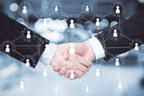 Handshake with global human resource interface and creative social network. Business and teamwork concept. Double exposure