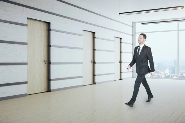 Businessman Walking Office Corridor Panoramic City View Daylight Many Doors — Stock Photo, Image