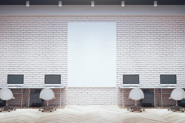 Workplace room with computers on table and empty vertical banner on brick wall. Business and company concept. Mock up, 3D Rendering