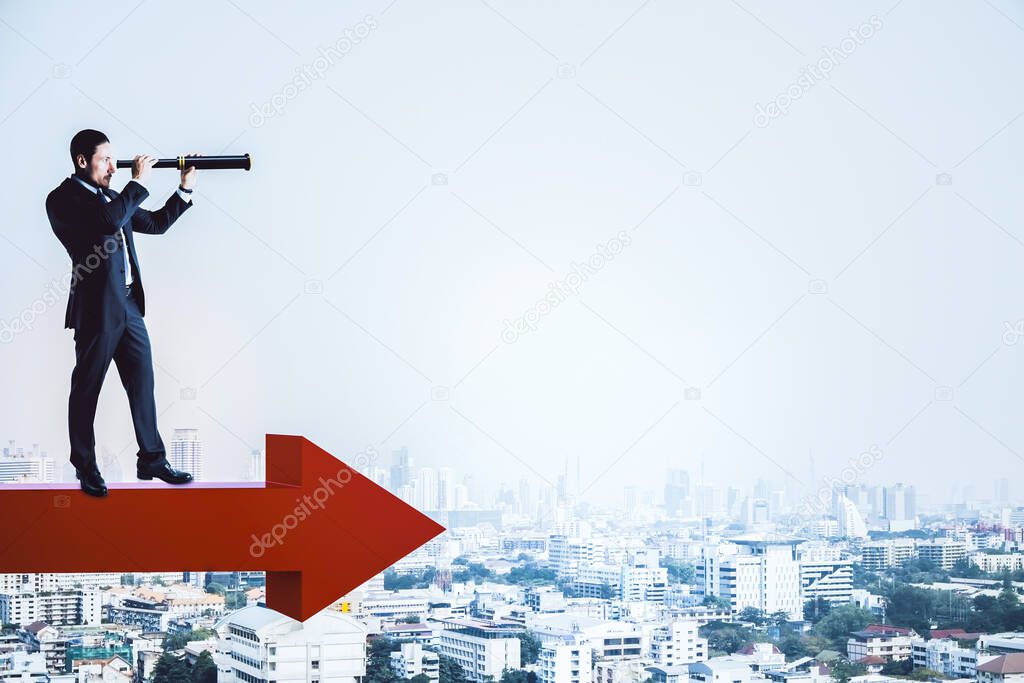 Businessman standing on red arrow and using binoculars to look into the distance on city background. Growth and research concept.