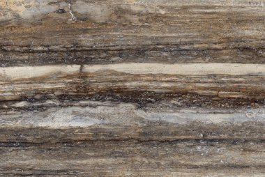 Koyu kahverengi renkli taş desenli doğal damarlı mermer.