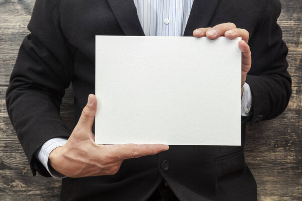 Man with a blank white sign. 